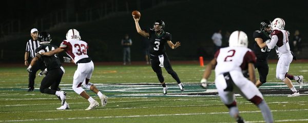 Michael Pina throwing a football in a football game