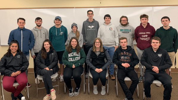 Nichols College students posing in two rows