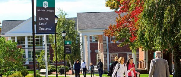 Students walking on campus by the Fels and Conant buildings