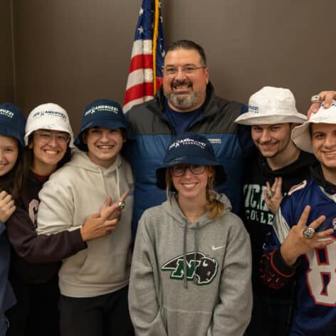 Joe Andruzzi poses with students